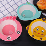 Three cartoon-style bowls on a dark surface with a checkered cloth in the background.