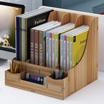 Wooden desk organizer with books and stationery items on a desk.
