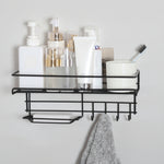 Black metal wall-mounted shelf with bathroom products on a white wall